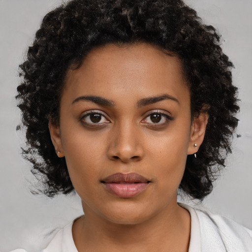 Neutral black young-adult female with short  black hair and brown eyes