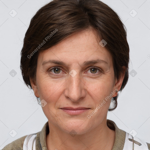 Joyful white adult female with medium  brown hair and grey eyes