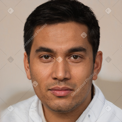 Joyful latino young-adult male with short  black hair and brown eyes