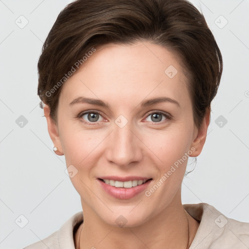 Joyful white young-adult female with short  brown hair and grey eyes