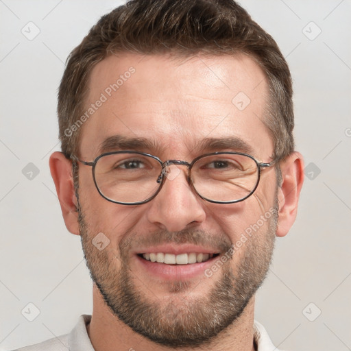 Joyful white adult male with short  brown hair and grey eyes