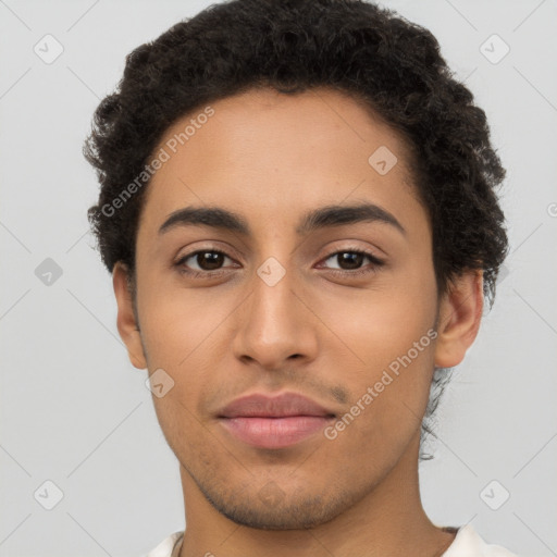 Joyful latino young-adult male with short  brown hair and brown eyes