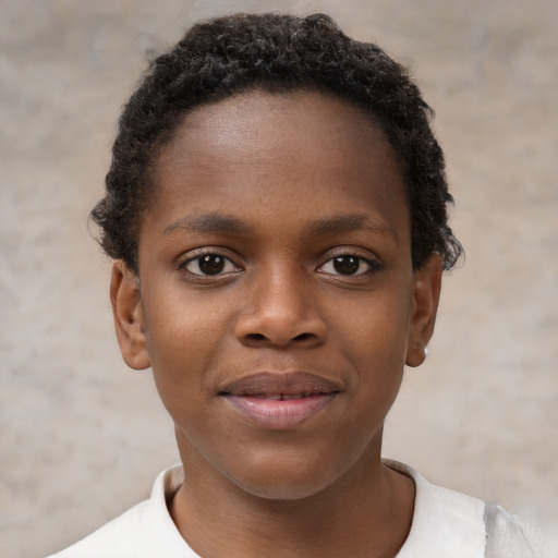 Joyful black child female with short  brown hair and brown eyes