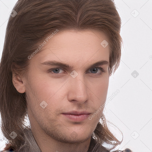 Neutral white young-adult male with long  brown hair and brown eyes