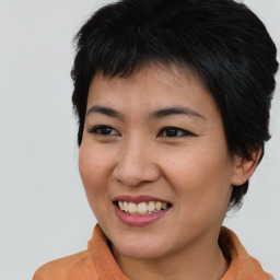 Joyful asian young-adult female with short  brown hair and brown eyes