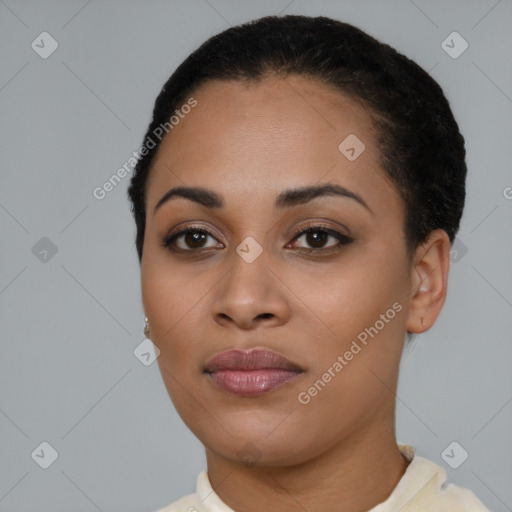 Joyful latino young-adult female with short  brown hair and brown eyes