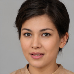 Joyful white young-adult female with medium  brown hair and brown eyes