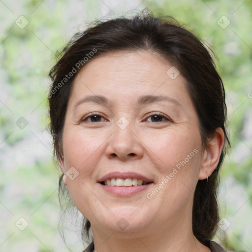 Joyful white adult female with medium  brown hair and brown eyes