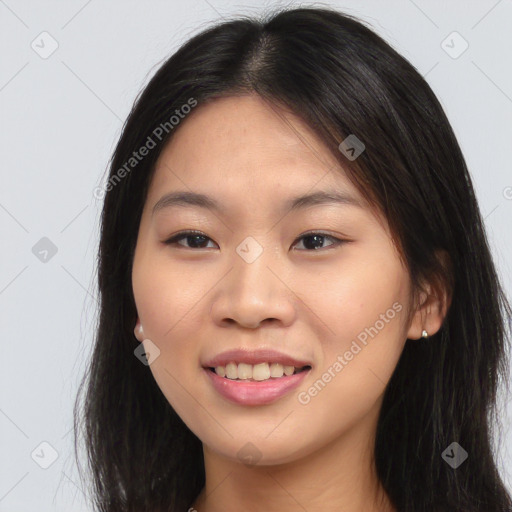 Joyful asian young-adult female with long  brown hair and brown eyes