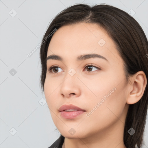 Neutral white young-adult female with long  brown hair and brown eyes