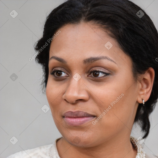 Joyful latino young-adult female with medium  brown hair and brown eyes