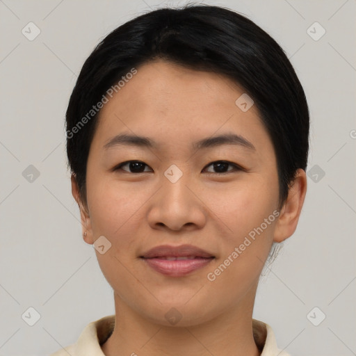 Joyful asian young-adult female with short  black hair and brown eyes