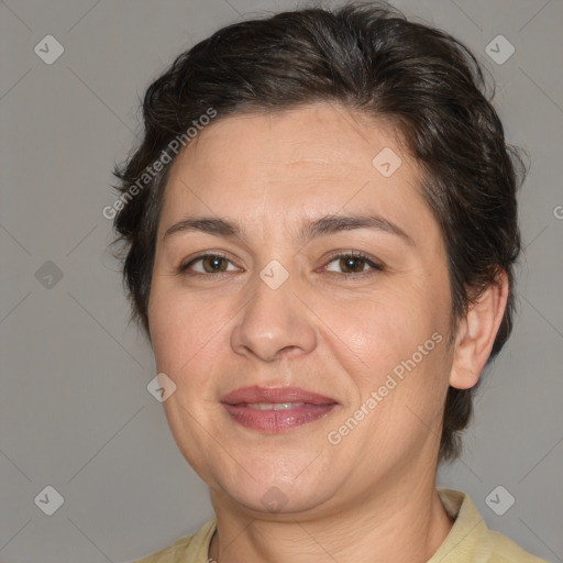 Joyful white adult female with medium  brown hair and brown eyes