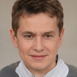 Joyful white adult male with short  brown hair and brown eyes