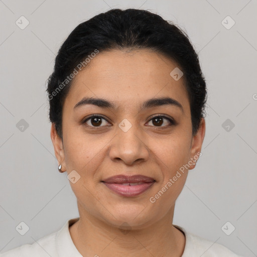 Joyful latino young-adult female with short  black hair and brown eyes