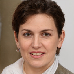 Joyful white adult female with short  brown hair and brown eyes