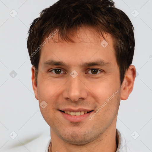 Joyful white young-adult male with short  brown hair and brown eyes