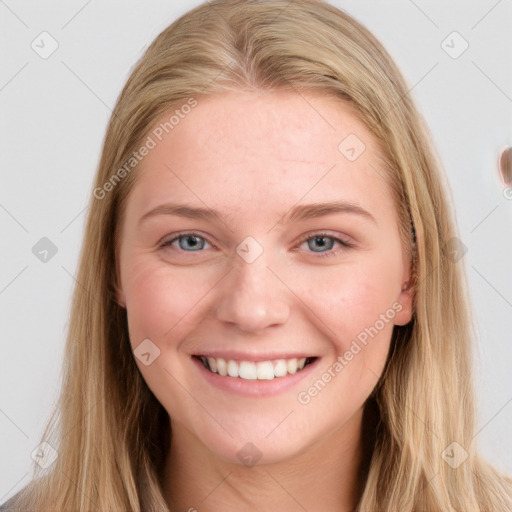 Joyful white young-adult female with long  brown hair and blue eyes