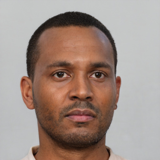 Neutral latino young-adult male with short  brown hair and brown eyes