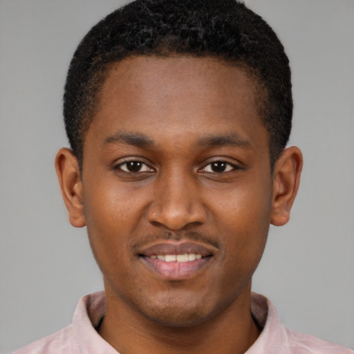 Joyful latino young-adult male with short  brown hair and brown eyes
