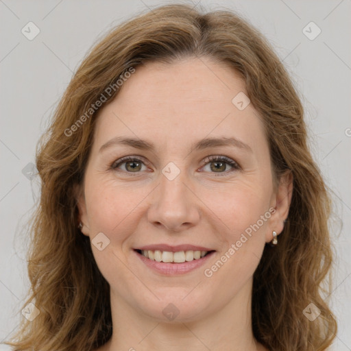 Joyful white young-adult female with medium  brown hair and green eyes