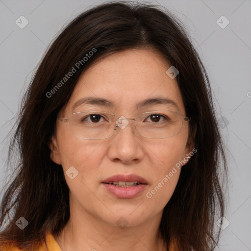 Joyful white adult female with long  brown hair and brown eyes