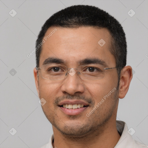 Joyful white young-adult male with short  black hair and brown eyes