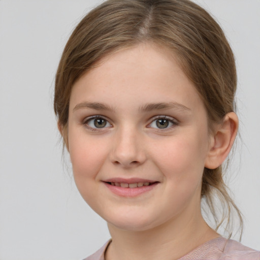 Joyful white child female with medium  brown hair and grey eyes