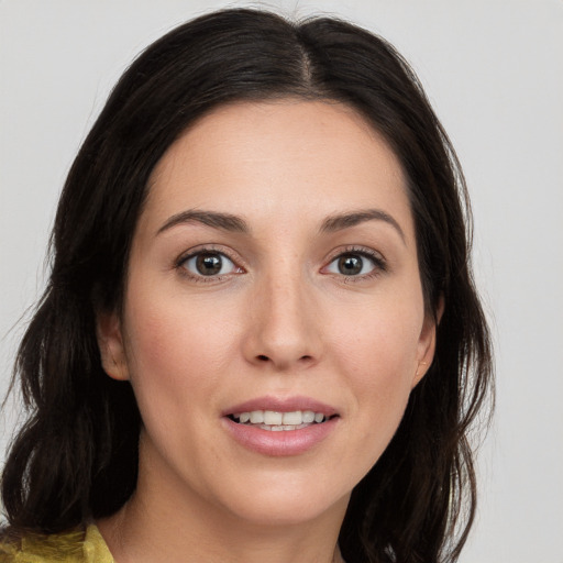 Joyful white young-adult female with medium  brown hair and brown eyes