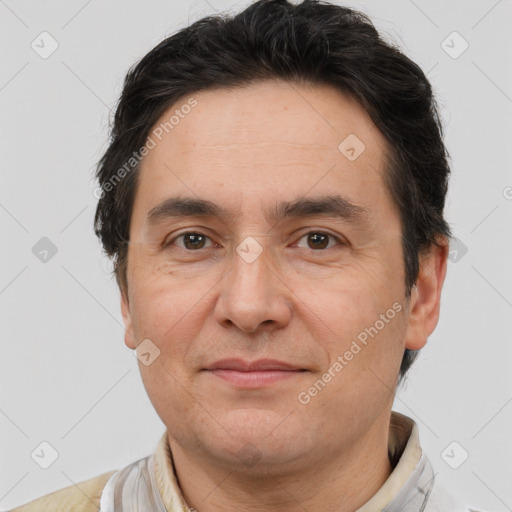 Joyful white adult male with short  brown hair and brown eyes