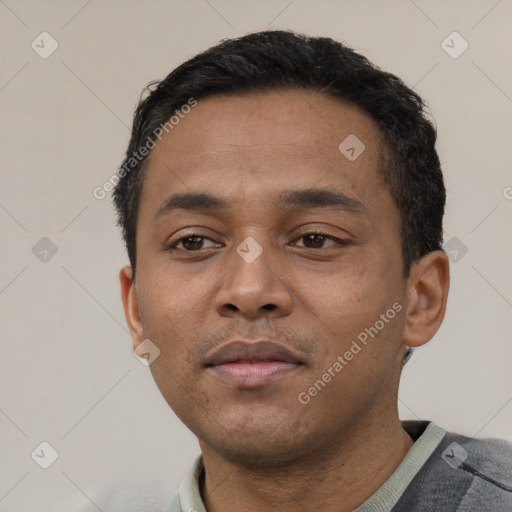 Neutral latino young-adult male with short  black hair and brown eyes