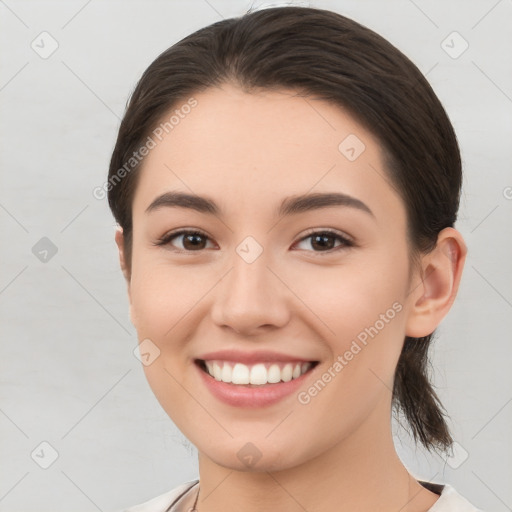 Joyful white young-adult female with medium  brown hair and brown eyes