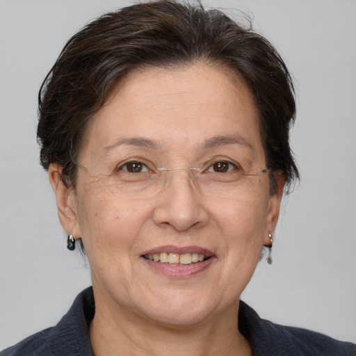 Joyful white middle-aged female with medium  brown hair and brown eyes