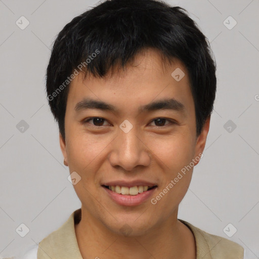 Joyful asian young-adult male with short  black hair and brown eyes