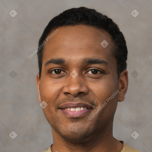 Joyful black young-adult male with short  black hair and brown eyes