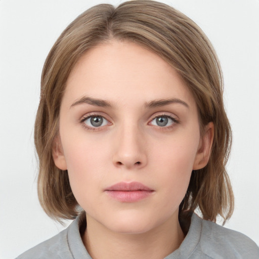 Neutral white young-adult female with medium  brown hair and grey eyes