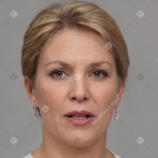 Joyful white adult female with medium  brown hair and grey eyes