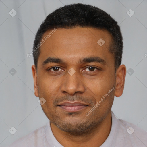 Joyful black young-adult male with short  black hair and brown eyes