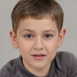Joyful white child male with short  brown hair and brown eyes