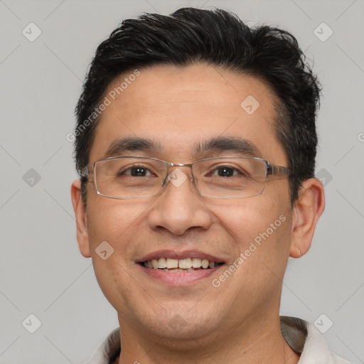 Joyful white adult male with short  brown hair and brown eyes