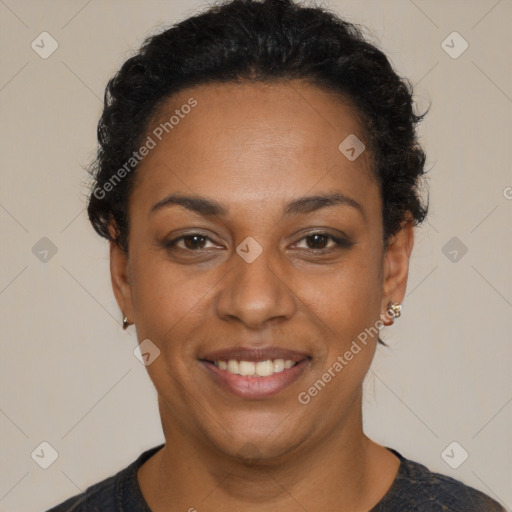 Joyful black adult female with short  black hair and brown eyes