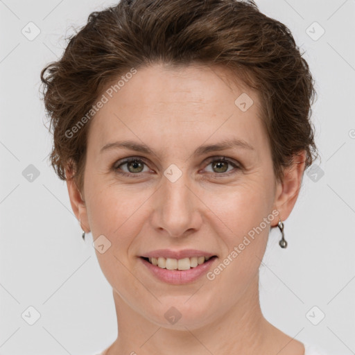 Joyful white adult female with short  brown hair and grey eyes