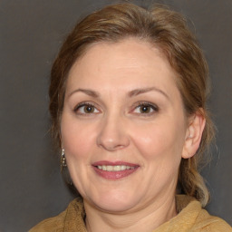 Joyful white adult female with medium  brown hair and brown eyes