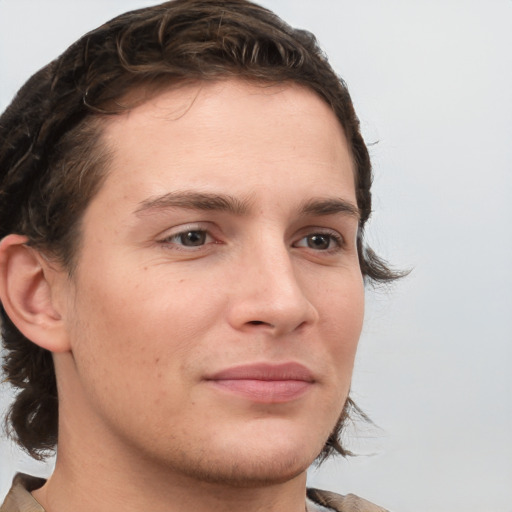 Joyful white young-adult male with medium  brown hair and brown eyes