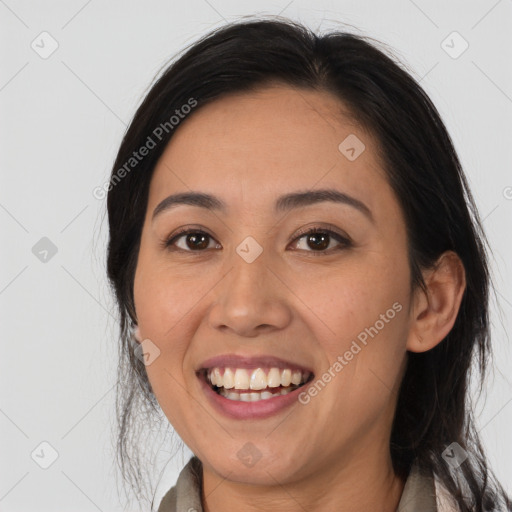 Joyful latino young-adult female with medium  black hair and brown eyes