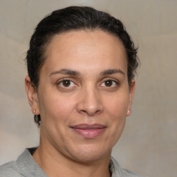 Joyful white adult female with short  brown hair and brown eyes