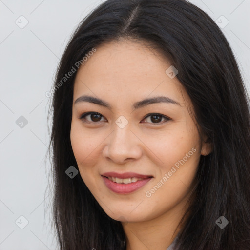 Joyful asian young-adult female with long  brown hair and brown eyes