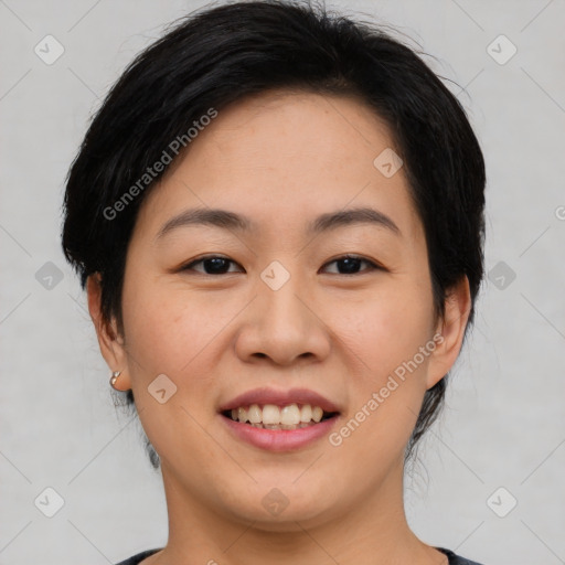 Joyful asian young-adult female with medium  black hair and brown eyes