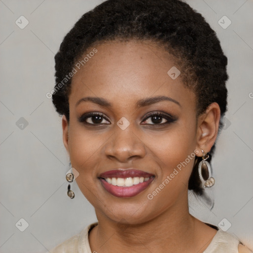 Joyful black young-adult female with medium  black hair and brown eyes