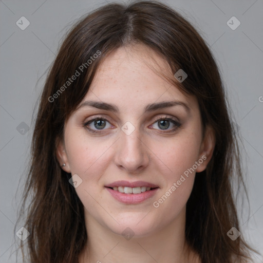 Joyful white young-adult female with long  brown hair and grey eyes